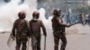 Kenya police officers are seen during an anti-government demonstration over tax hikes and a controversial now-withdrawn tax bill in downtown Nairobi, on July 2, 2024.
