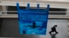 FILE - A delegate walks past a banner during a break at the International Civil Aviation Organization's (ICAO) global safety meeting in Montreal, Feb. 4, 2015. Taiwan has not been invited to attend the upcoming event Sept. 27, following pressure from China.