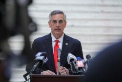 FILE - Georgia Secretary of State Brad Raffensperger speaks during a news conference at the State Capitol in Atlanta, Georgia, Nov. 6, 2020.