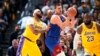 Nikola Jokić u duelu sa Entonijem Dejvisom i Lebronom Džejmsom (Foto: AP/David Zalubowski) 