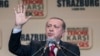 FILE - Turkey's President Recep Tayyip Erdogan gestures as he speaks to supporters of his ruling Justice and Development Party as they rally to denounce violence by Kurdish rebels, in Strasbourg, eastern France, Oct. 4, 2015. 