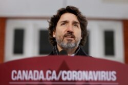 FILE - Canada's Prime Minister Justin Trudeau attends a news conference at Rideau Cottage, in Ottawa, Ontario, Canada, Jan. 22, 2021.