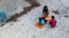 An undated image supplied by Amnesty International claims to show children playing near at the Australian-run detention center on the Pacific island nation of Nauru. 