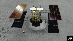 FILE - This computer graphic image provided by the Japan Aerospace Exploration Agency (JAXA) shows the Japanese unmanned spacecraft Hayabusa2 approaching on the asteroid Ryugu.
