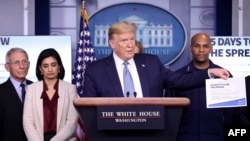 WASHINGTON, DC - MARCH 16: U.S. President Donald Trump, joined by members of the Coronavirus Task Force, speaks about the coronavirus in the press briefing room at the White House on March 16, 2020 in Washington, DC. The United States has surpassed…