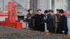 Arhiva - Severnokorejski lider Kim Džong Un, u centru, tokom posete fabrici "16. mart" na fotografiji koju je objavila državna novinska agencija Severne Koreje KCNA, 4. novembra 2019.