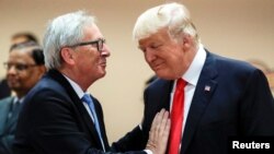 Junker i Tramp n asamitu Grupe 20 u Hamburgu prošlog jula (Foto: Reuters/Markus Schreiber, Pool)