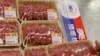 An employee arranges beef products in a supermarket in Taipei (2009 file photo)