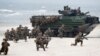 FILE - U.S. Marines with Amphibious Assault Vehicles take a part in a landing operation during a military Exercise Baltops 2018 at the Baltic Sea, some 340 kms (211 miles) west north of the capital Vilnius, Lithuania, June 4, 2018.