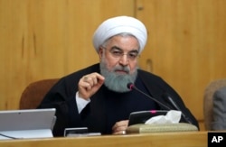 Iranian President Hassan Rouhani speaks in a cabinet meeting in Tehran.