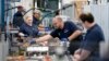 FILE - Employees work in the battery assembly hall at the BMW Spartanburg plant in Greer, South Carolina, on Oct. 19, 2022. Statistics released on Dec. 6, 2024, show the United States added 227,000 jobs in November.