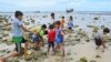 Children of newly arrived Rohingya refugees play at a beach on Sabang island, Aceh province, Indonesia, on Dec. 2, 2023. With the year not over yet, the number of Rohingya fleeing refugee camps in Bangladesh by boat already has eclipsed the 2022 total.