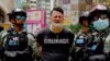 Police detain a protester after being sprayed with pepper spray during a protest in Causeway Bay before the annual handover march in Hong Kong, July 1, 2020.