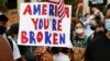 Seorang pengunjuk rasa membawa poster di Plaza Black Lives Matter dekat Gedung Putih dalam unjuk rasa memprotes diskriminasi rasial di Washington D.C, Sabtu, 6 Juni 2020, setelah kematian pria Afrika-Amerika, George Floyd, di Minneapolis saat ditahan poli