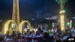 Iraqis sit at a popular café in the old city of Mosul on Sept. 2, 2024, seven years after the Islamist State (IS) group was ousted from the northern Iraqi city. 