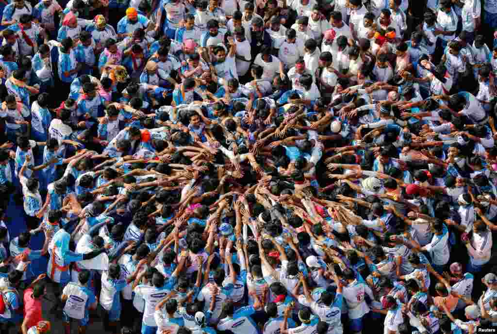 Devotees form a human pyramid to celebrate the festival of Janmashtami, marking the birth anniversary of Hindu Lord Krishna, in Mumbai, India.