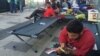 Many refugees sleep outside Austria station, refusing government provided housing after word "camp" became associated with detentions in recent months, Sept. 15, 2015. (H. Murdock / VOA) 