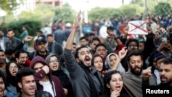 Protesters shout criticism of the Citizenship Amendment Bill, which seeks to give citizenship to religious minorities persecuted in neighboring Muslim countries, at Jamia Millia Islamia University in New Delhi, India, Dec. 14, 2019.