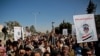 Houthi supporters chant slogans during a rally outside the closed U.S. embassy over obver the decision of the Trump administration to designate the Houthis a foreign terrorist organisation, in Sana'a, Yemen, Jan. 18, 2021.
