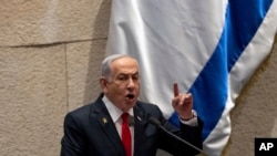 FILE - Israel's Prime Minister Benjamin Netanyahu addresses lawmakers in the Knesset, Israel's parliament, in Jerusalem, Nov.18, 2024.