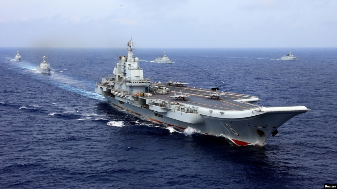 China's aircraft carrier Liaoning takes part in a military drill of Chinese People's Liberation Army (PLA) Navy in the western Pacific Ocean, April 18, 2018. 