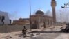 File - An image grab taken from a video allegedly shows Islamic State fighters in a street of Ramadi, Iraq. 