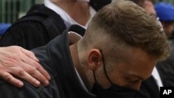 Finnegan Lee Elder listens as the verdict is read, in the trial for the slaying of an Italian plainclothes police officer, in Rome, May 5, 2021.