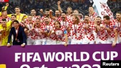 Yan wasan kasar Croatia bayan samun nasarar zuwa na uku a gasar kwallon kafa ta duniya.