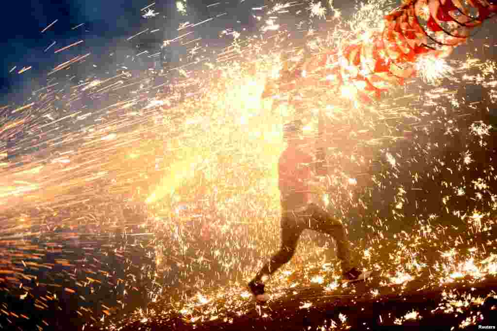 Ethnic Miao people celebrate Lantern Festival with fireworks in Taijiang, Guizhou Province, China, Feb. 22, 2016.