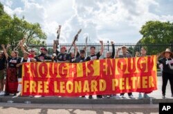 Indigenous leaders and allies gather outside the White House to urge President Joe Biden to grant clemency to imprisoned activist Leonard Peltier on Sept. 12, 2023, in Washington.