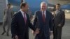 U.S. Secretary of State Rex Tillerson chats with Pakistani foreign office official, Sajid Bilal, as he arrives to the Nur Khan military airbase in Islamabad, Pakistan, Oct. 24, 2017. 