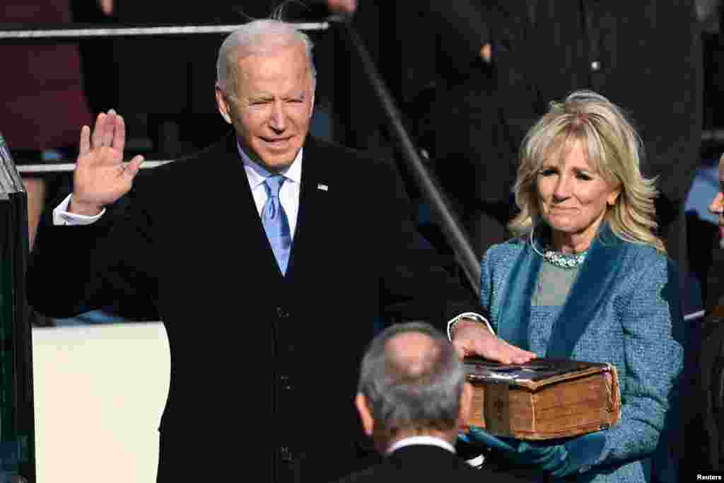 RU.S. President-elect Joe Biden is sworn in as the 46th U.S. President, at the U.S. Capitol in Washington, U.S., January 20, 2021. Saul Loeb/Pool via REUTERS