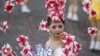 A dancer adorned with flowers performs during Taiwan's National Day celebrations in front of the Presidential Office in Taipei October 10, 2012. 