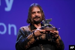 FILE - Director Warwick Thornton is awarded the Jury Special Prize for 'Sweet Country' during an award ceremony at the 74th Venice Film Festival at the Venice Lido, Italy, Sept. 9, 2017, following a pre-release screening.
