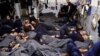 FILE - Foreign prisoners, suspected of being part of the Islamic State, lie in a prison cell in Hasaka, Syria, Jan. 7, 2020. 