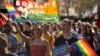 Supporters of same-sex marriage carry banners and shout slogans as they march in Sydney, Australia, Aug. 6, 2017.
