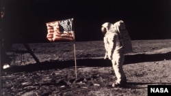 Astronaut Edwin E. "Buzz" Aldrin Jr. poses for a photograph beside the U.S. flag deployed on the moon during the Apollo 11 mission on July 20, 1969. (AP Photo/NASA/Neil A. Armstrong)