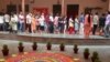 Voters line up at polling booths in the capital New Delhi where voting was held Sunday in the second last round of India's staggered general election. 