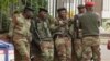 FILE: Soldiers are seen on the street in central Harare, Zimbabwe, Nov. 16, 2017. 