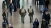 Belgian soldiers patrol the departure hall of Zaventem international airport near Brussels, Nov. 22, 2015, after security was tightened in Belgium following the fatal attacks in Paris.