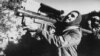 FILE - An Afghan guerrilla handles a U.S.-made Stinger anti-aircraft missile in this photo made between November 1987 and January 1988. 