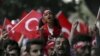 On the same day as a PKK bombing in Igdir province, supporters of ultranationalist groups march with Turkish national flags during a protest against Kurdish militant attacks on Turkish security forces, in Istanbul, Sept. 8, 2015.