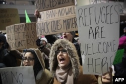 Demonstrators protest President Donald Trump's executive order which imposes a freeze on admitting refugees into the United States and a ban on travel from seven Muslim-majority countries at the international terminal at O'Hare Airport, Jan. 29, 2017 in Chicago, Illinois.