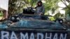 A Philippines army soldier stands on a tank inside the city hall compound in Marawi as government forces continue their assault against insurgents from the Maute group, June 25, 2017. 