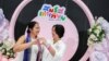 An LGBTQ+ couple poses for a photo after receiving official marriage certificates, as Thailand's marriage equality bill came into effect, in Bangkok, Jan. 23, 2025.