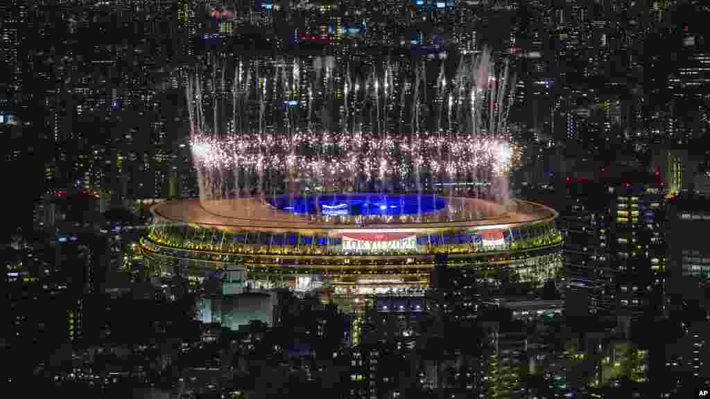 Fireworks illuminate over National Stadium during the closing ceremony of the 2020 Tokyo Olympics, Sunday, Aug. 8, 2021, in Tokyo. (AP Photo/Kiichiro Sato)
