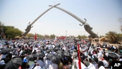 FILE - Followers of Shiite cleric Muqtada al-Sadr gather during open-air Friday prayers at Grand Festivities Square in Baghdad, Iraq, Aug. 5, 2022. 