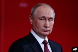 FILE - Russian President Vladimir Putin delivers his speech at a ceremony to mark the 75th anniversary of Russian Federal Medical-Biological Agency in Moscow, Nov. 9, 2022. Putin will not attend the Group of 20 summit in Indonesia next week.