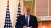 U.S. President Donald Trump poses on the Truman Balcony of the White House after returning from being hospitalized at Walter Reed Medical Center for coronavirus disease (COVID-19) treatment, in Washington, Oct. 5, 2020. 