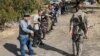 Relawan sipil Armenia menjalani latihan militer di kota Yerevan (27/10), di tengah konflik dengan Azerbaijan di Nagorno-Karabakh.